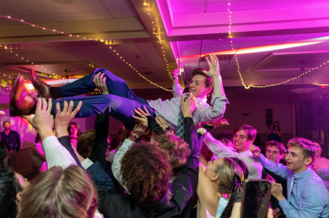 Kevin Dutton crowd surfs at CHS prom.