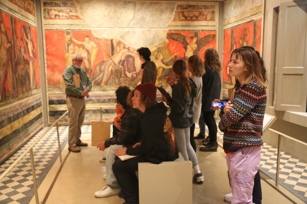 Senior Sadie Barber is viewing a drawing wall and learning the history of roman empires. The museum was so much fun. Barber said, It was a good way to get out of class and be able to see some artifacts. The class enjoyed a more visual experience, instead of just being in class.