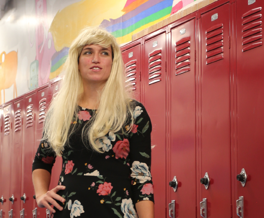 Hannah Crabtree puts on their wig for “Barbie Vs. Ken Day.” They dressed up “Malibu Business Barbie.” “I like to go hard for spirit week because it helps shake things up in a fun way,“ Crabtree said. “I really like how many people participate at Community.