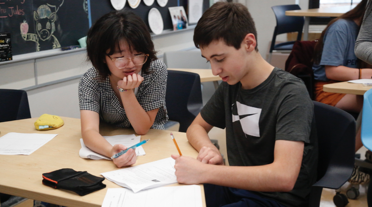 Shanon Kawata (left) and Oliver Jacobson (right) work on a math problem. They both elected to take Advanced Calculus this year. “I really only had two options: Calc AB or Calc BC,” Jacobson said. “I’m a sophomore right now,soIhavea bunch of free time on my hands, and I figured I could take one pretty hard class, so why not?”