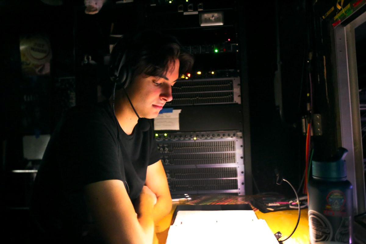 CET’s stage manager, Parker Haymart, calls the dress rehearsal in the light booth. He has developed many bonds while stage managing, especially during Tech Week, when he spends his time calling shows. “I didn’t know coming into CET that I would find all these connections,” Haymart said. “I wouldn’t trade these friendships I have with everyone for anything.”