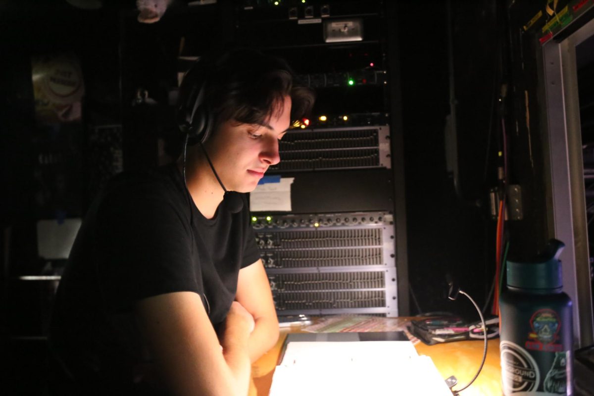 CET’s stage manager, Parker Haymart, calls the dress rehearsal in the light booth. He has developed many bonds while stage managing, especially during Tech Week, when he spends his time calling shows. “I didn’t know coming into CET that I would find all these connections,” Haymart said. “I wouldn’t trade these friendships I have with everyone for anything.”