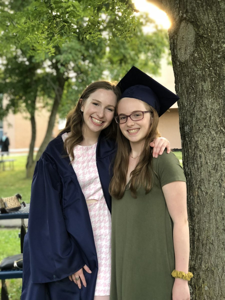 Emily Yesowitz (right) stands with her sister, Hope, on the day of her high school graduation. The Yesowitz sisters six-year age difference made it difficult for them to connect. I’ve always kind of rushed to be at her level, tried to catch up so desperately, Yesowitz said. You can only do that so much… at one point, you’re still six years younger, no matter how hard you force yourself to be older in your mind.