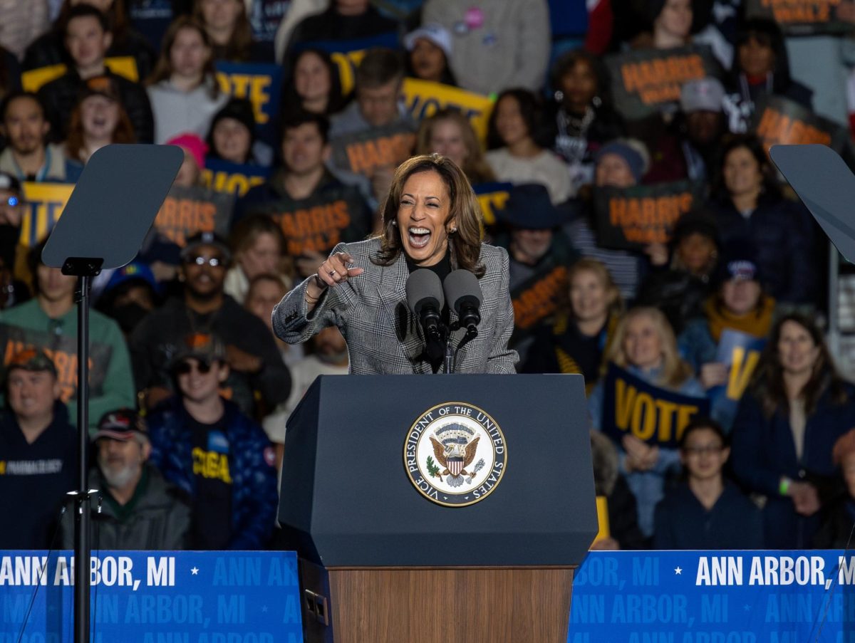 Kamala Harris laughs as she speaks to a spirited crowd on Monday night in Ann Arbor.