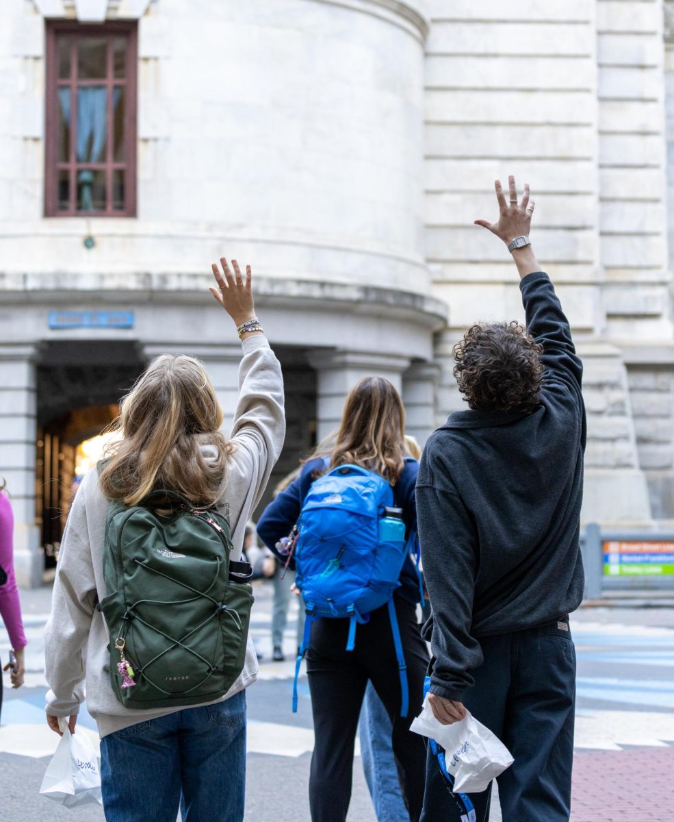 Clara Freeth (left) and Malcolm London (right) look up to admire a building in Philadelphia. Members of The Communicator took a trip to Philadelphia recently to attend the JEA national journalism conference. This picture was taken while the group was on a tour of the city.