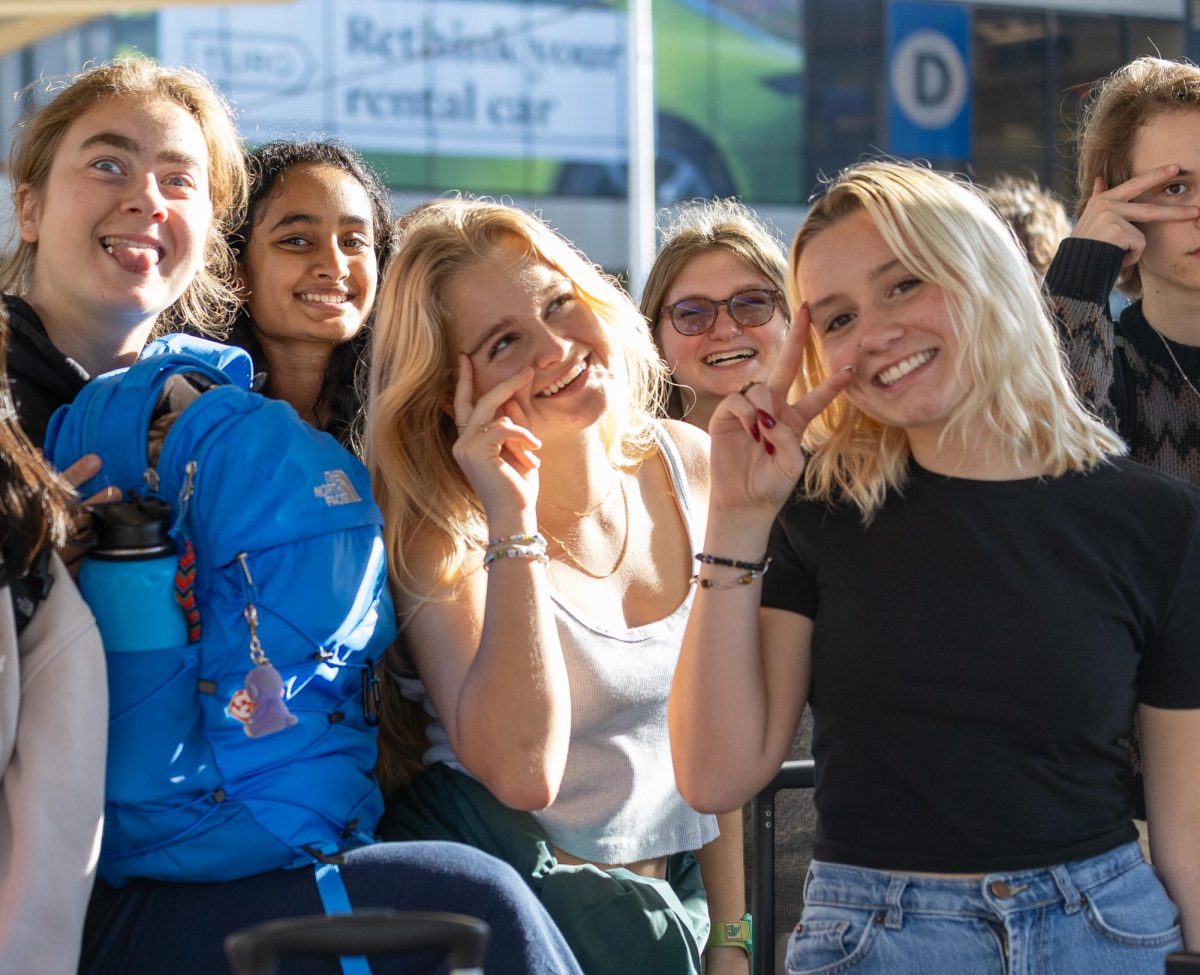 Lucia Page Sander, Janaki Nallamothu, Clara Freeth, Mia Rubenstein, Claire Lewis and Luca Hinesman pose after the flight to their Philadelphia journalism trip. 