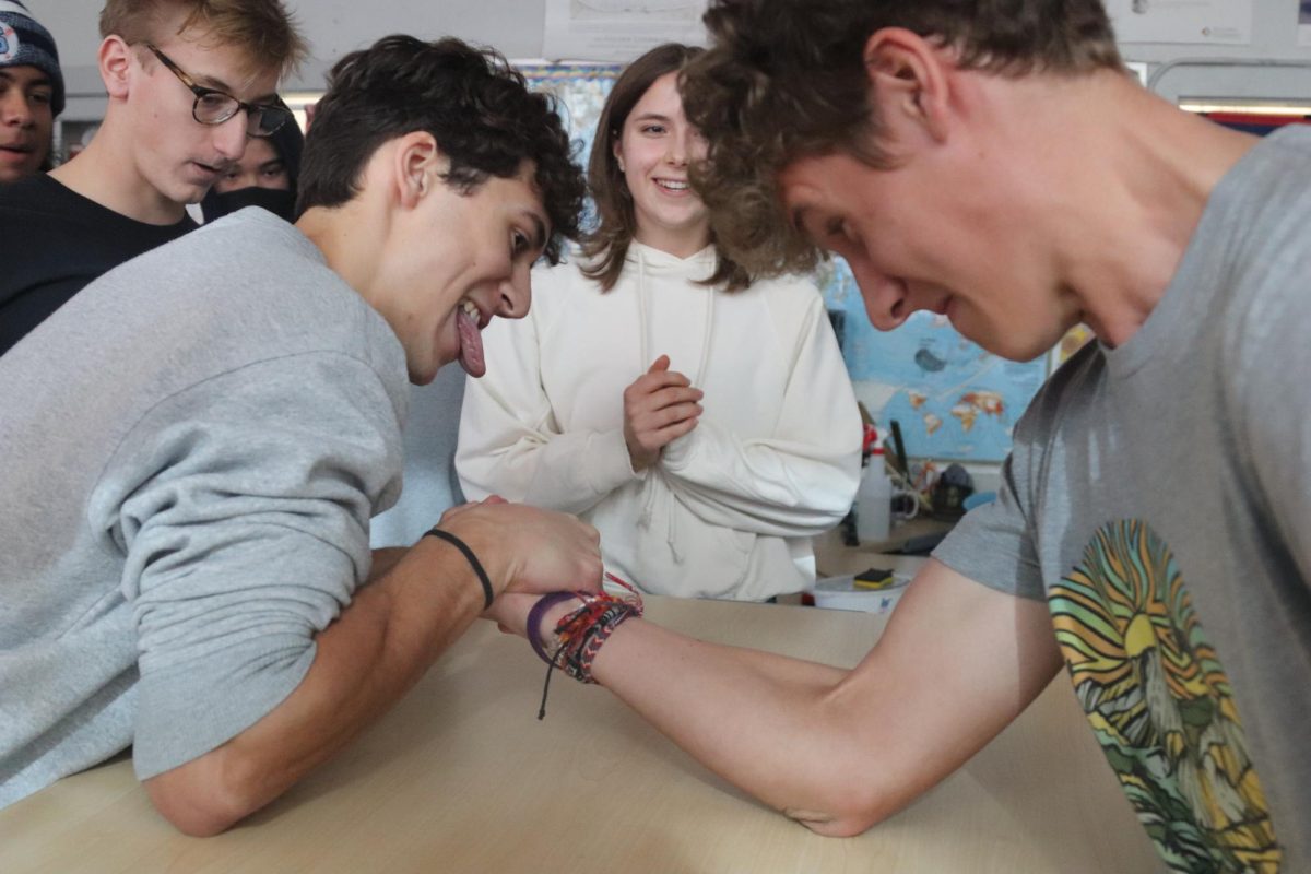 Leo Castilho and Walker Ledbetter have an arm wrestling battle in Chloe Roots room (205), as Vivian Simmons refs. Students entered money for the Food Gatherers fundraiser in order to compete. 