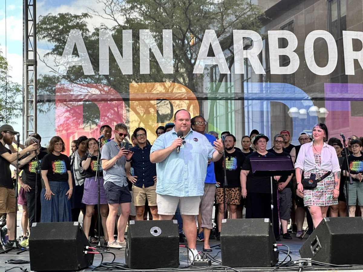 Photo courtesy of Travis Radina

Travis Radina delivers remarks at Ann Arbor Pride. Having held the position of president at the Jim Toy Community Center for four years, he addressed the crowd with pride. "Having progressive, diverse voices at the table where decisions are being made is really important to make sure that we're calling out that hate and stopping it from becoming policy," Radina said. "If somebody's willing to say slurs, what are they willing to legislate?"