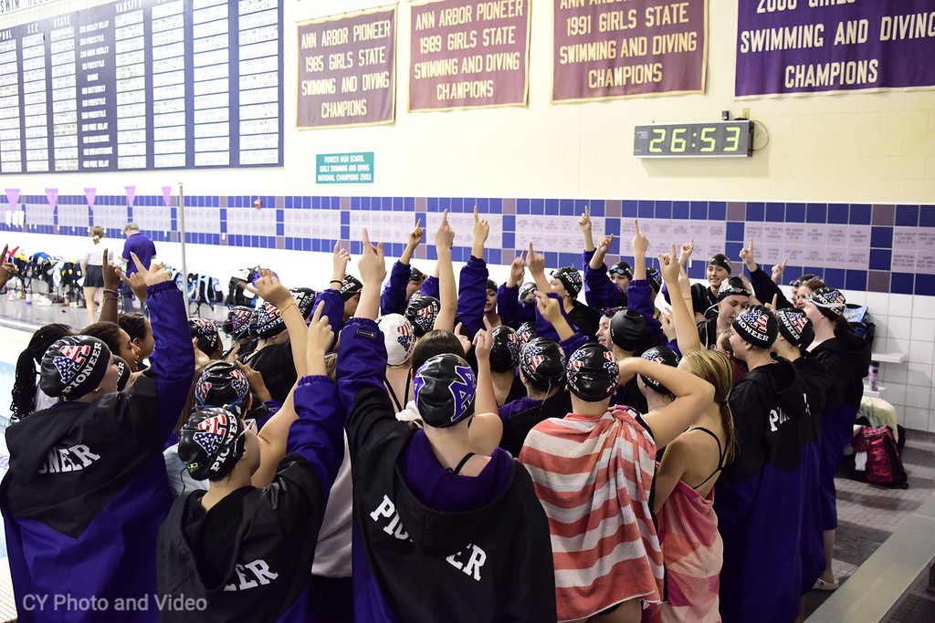 Photography by: Chuck Yadmark
Pioneer swim and dive team sings team cheer before the meet starts.