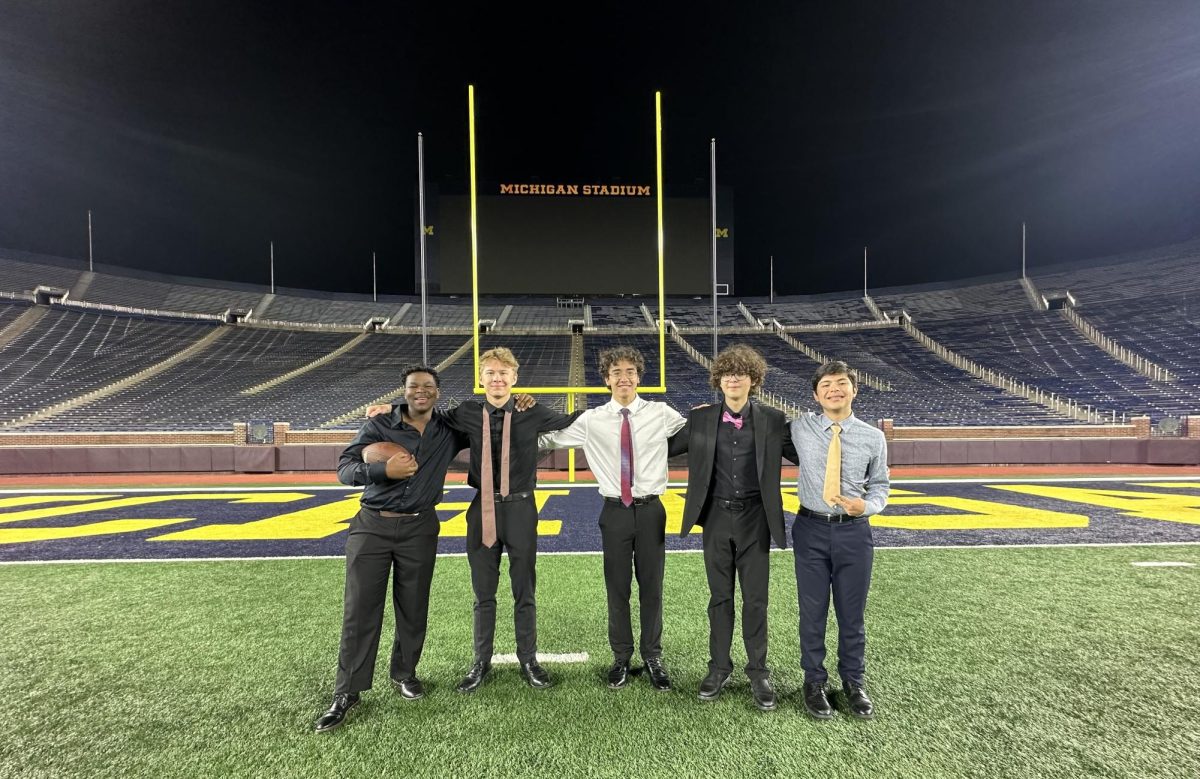 Photography by: Jack Wagner
The CHS Jazz Band stand on the Big House's Field after their performance at the American Heart Association Fundraiser.