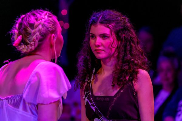 Toula Greenawalt stares down Claire Lewis during a tense scene where their characters fight.