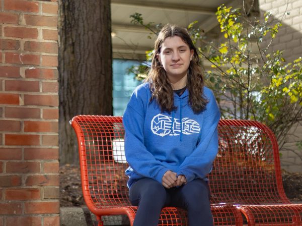 Nora O'Neill, a sophomore at CHS and SHS, poses at a popular lunch spot in Kerrrytown. Her days are hectic and packed with choir, volleyball and classes at two schools.