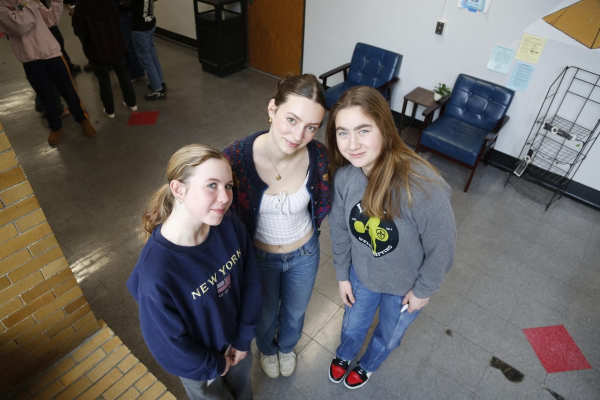 Nina Beals, Lucia Page Sander and Kennedy McDonald pose for a bird's-eye shot during their family photo challenge. Beals thought this was a great opportunity to bond with her family and learn how to take new kinds of photos. "Ionie is super good at taking photos," Beals said. "So it was a great chance to learn from a pro and work with new people."