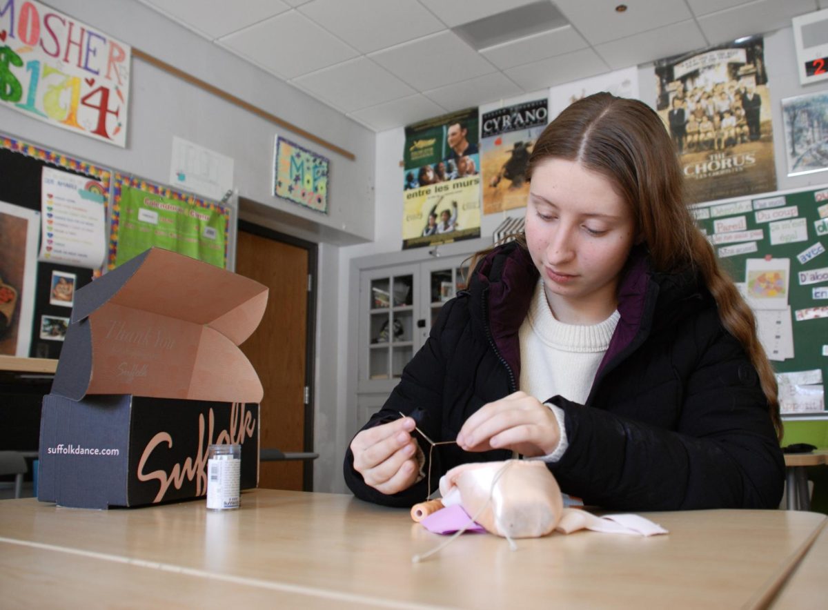 Emma Goblirsch takes time out of her busy day to sew her new pointe shoes to prepare for a dance competition over the weekend. Goblirsch loved being able to add her own special touch to the shoes, despite the extra time and energy it took. "They come without any elastics or ribbons attached, so everyone sews them on by themselves. It takes a really long time, but then they're perfect," Goblirsch said. "Everyone wants some variety. Sometimes I sew my back elastic crisscross, sometimes I sew them in just one loop, and sometimes I add extra elastic to the front."