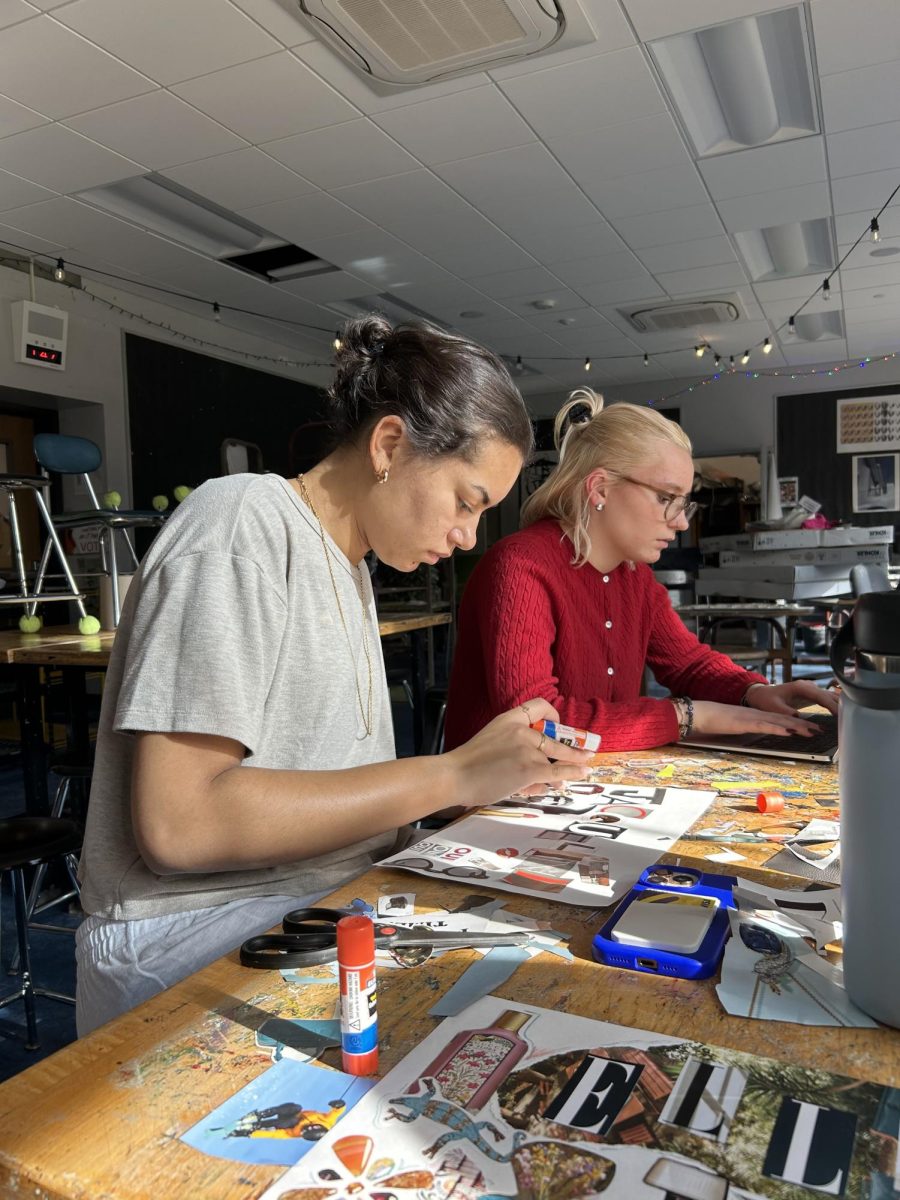 Jacqueline Boynton glues cutouts onto paper to make a collage in her new ceramics class. One of Boynton's first assignments was to create a nameplate for her cubby, and she took full creative liberty in making hers. "I feel like I haven't had space to be creative like that in a long time," Boynton said. "I really enjoyed just being able to have fun with art, and I can't wait to see what the rest of this class has to offer."