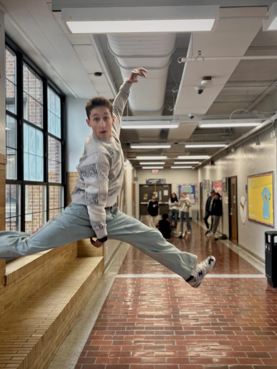 Alden Koschmann hits the iconic Jumpman pose mid-air in the second-floor hallway. Koschmann was quick to jump into action on Wednesday and be the star of his family's photo scavenger hunt! "I actually really like the smaller family activities," said Koschmann. "I think they're especially good for [fourth] block because we have so many people."