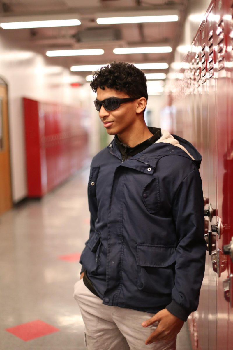 Kareem Alwan stands in the third floor hallway wearing a new pair of sunglasses. Alwan spent most of the last semester in Egypt, and has only recently returned to CHS. "It's great to be back and get to hang out here again," Alwan said. "It's just a shame nobody plays basketball anymore."