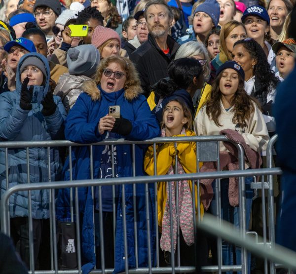 Supporters stand behind layers of barricades at the Harris/Walz rally in Ann Arbor. 