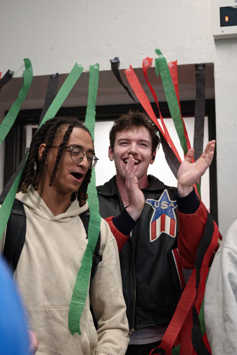 Seniors Isaiah Horton and Ryan Grant walk into their forum room on senior send off day. Johnson Forum had set up cake, popcorn, and goodbye gifts for them. “I really enjoy senior send off,” Ellie Fox, a junior in Johnson Forum, said. “It gives us one last time to really celebrate and say goodbye to our seniors. It was especially important to me this year because it was the last send off before my own.”