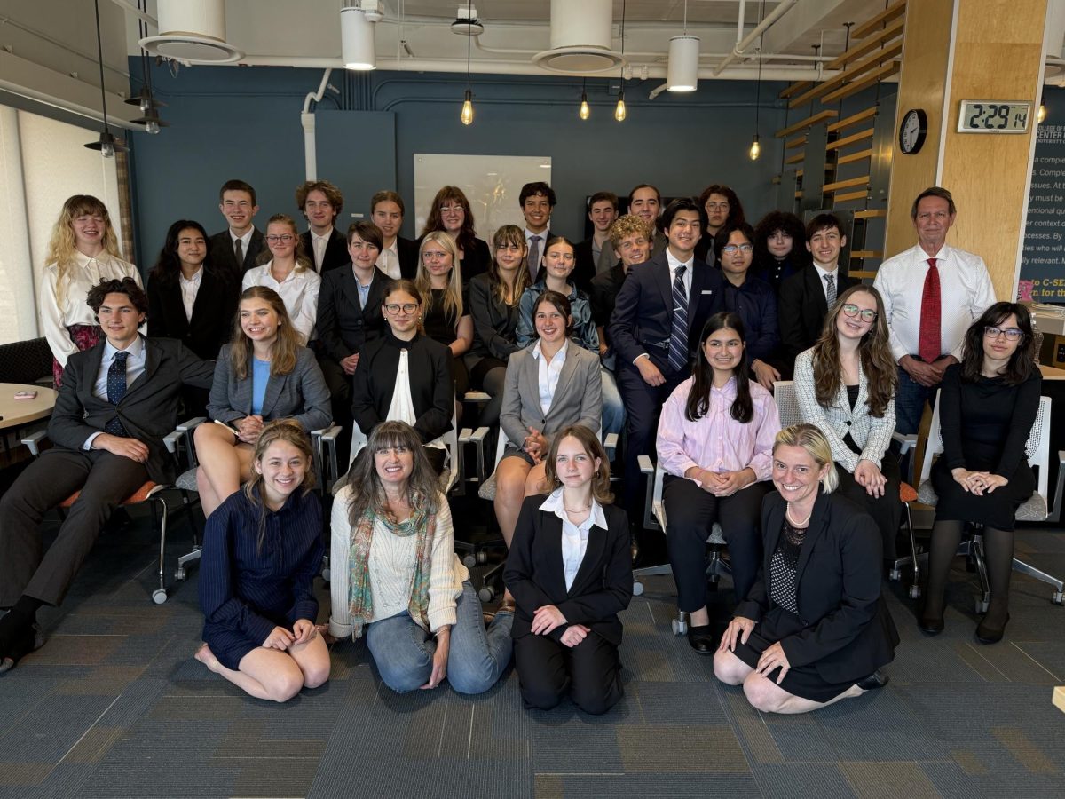 The CHS Mock Trial team sits for a full-team photo during a lunch break on the second day of the Empire Mock Trial competition.