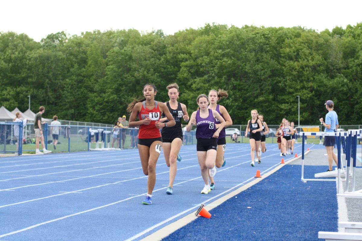 Girls run their second lap in the 1600.