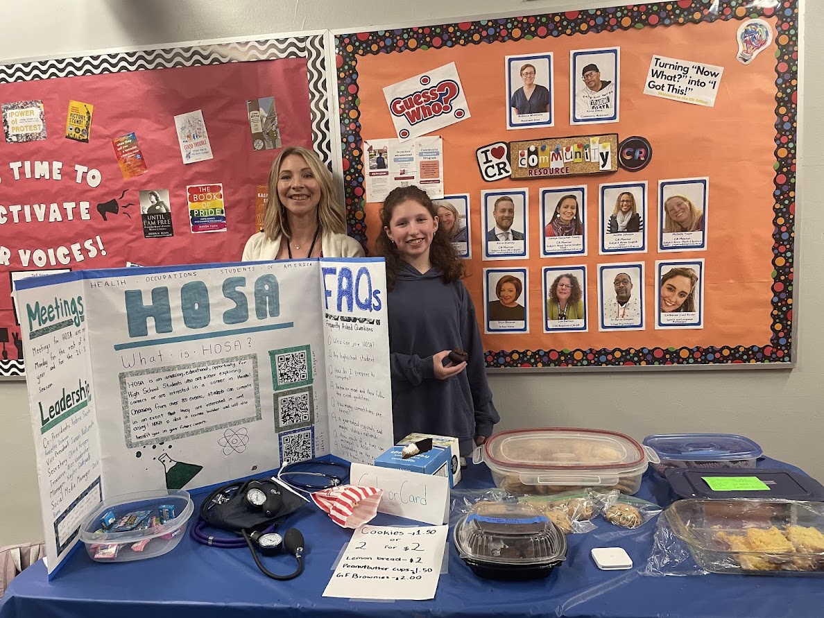 HOSA Social Media Manager, Della Bank and CHS Science teacher, Andrea Adams stand behind HOSA's information and bake sale booth at Commstock. They sold baked goods with the hope to bring in funding for the program's competition season the following year. "It was a lot of fun, I can't remember who thought of the bake sale idea but it’s a pretty popular fund-raiser method." Bank said. "We got someone to buy an entire half-batch of brownies that a club member made!"