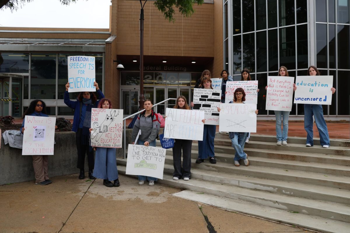 Protesters stand on the steps of the Federal Building in downtown Ann Arbor. Janaki Nallamothu, a CHS junior, attended to protest removals of DEI programs and government exclusions of marginalized communities. "My friend Kaylee organized this and came to me with the idea," Nallamothu said. "I thought it was an amazing idea that we students could participate in. We ended up having a lot of people show up and talk, so I would say it was successful."
