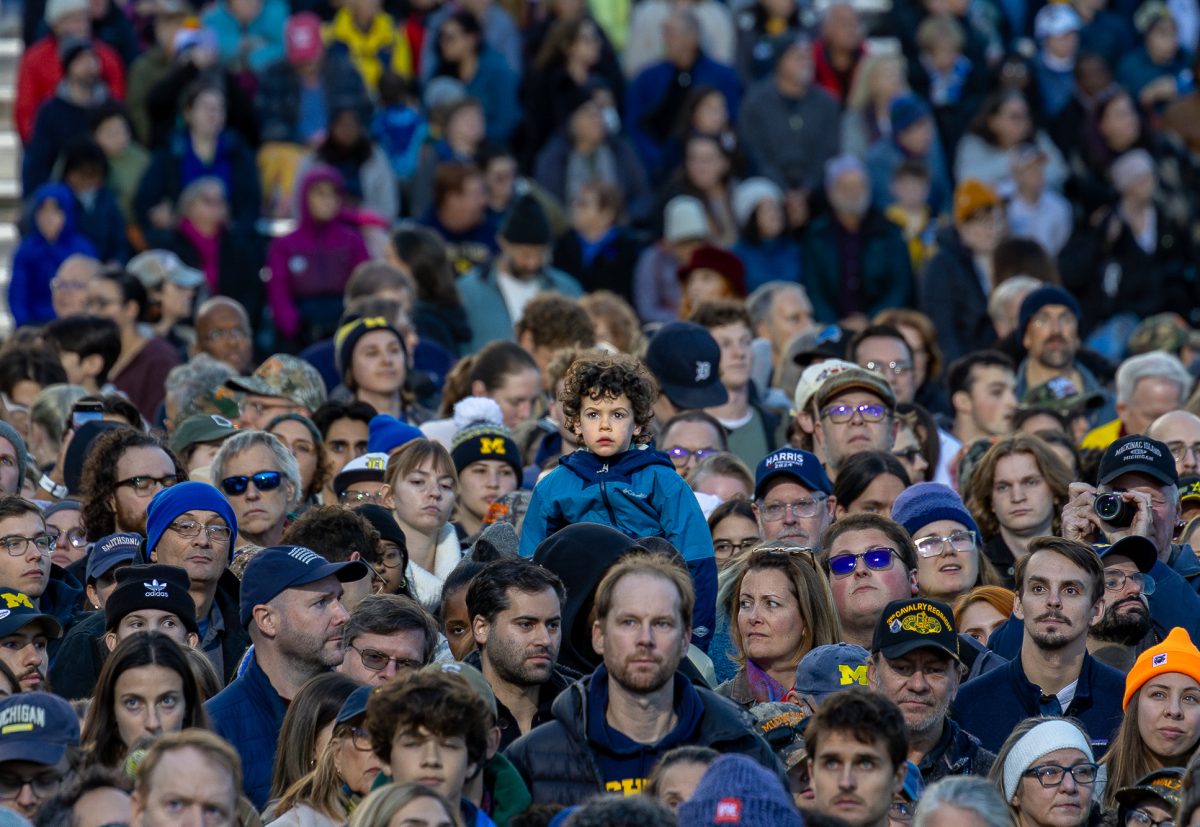 A young spectator, full of curiosity, gazes at Kamala Harris during her rally in Ann Arbor, Michigan, on Oct. 28. The child’s presence reflected the diversity of the crowd, as people of all demographics and ages turned out for the vibrant and hopeful gathering.