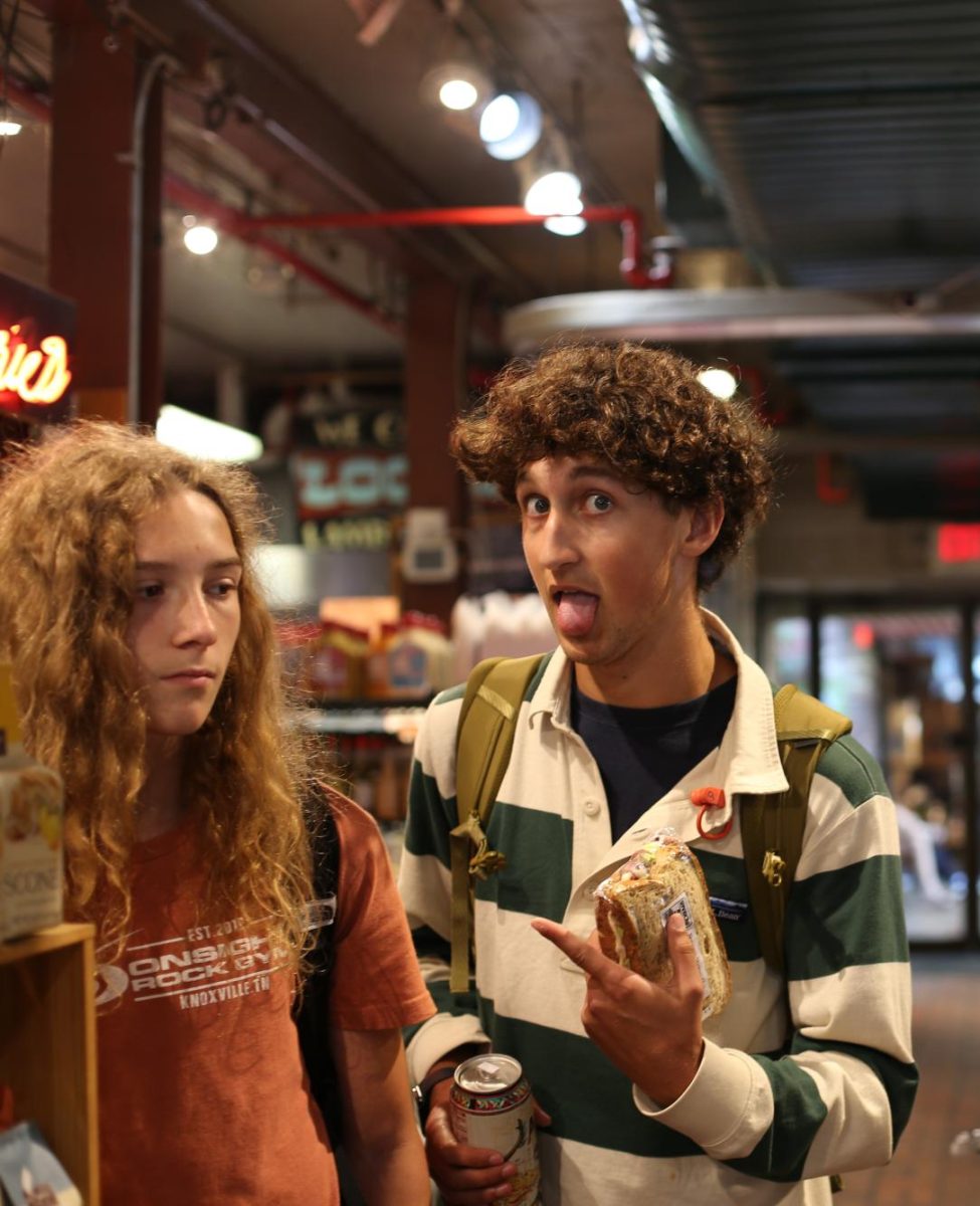 Alden Koschmann sticks out his tongue in the midst of sandhich shopping in Kerrytown. Koschmann spends his lunch period with his new freshman friend Wesley, in order to show teach him how things are done at Community. "I've been teaching him {Wesley} the Community ways," Koschmann said. "Today we learned what the best sandwich from Kerrytown is." 