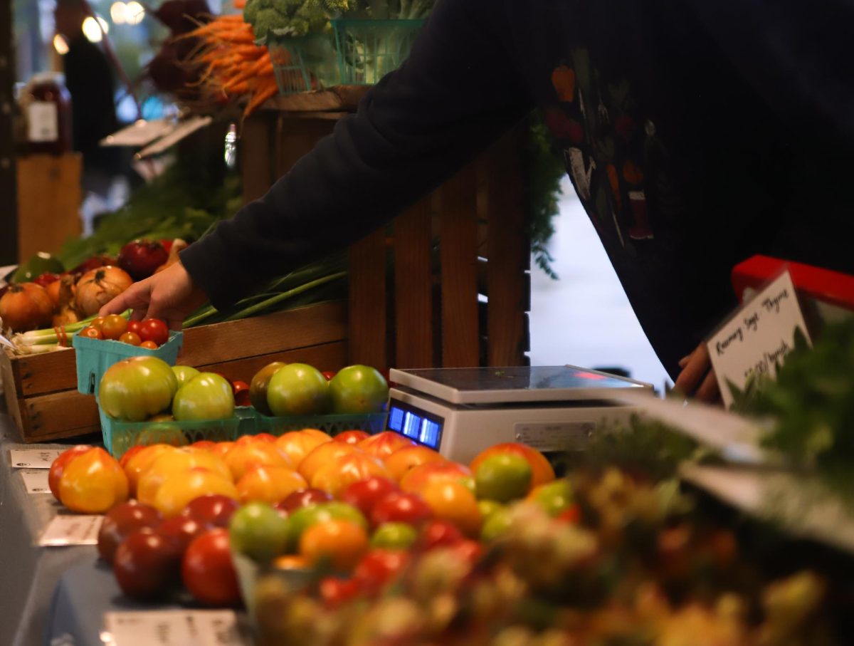 Fresh fruits being bought at the farmers market on Sept. 25.  
