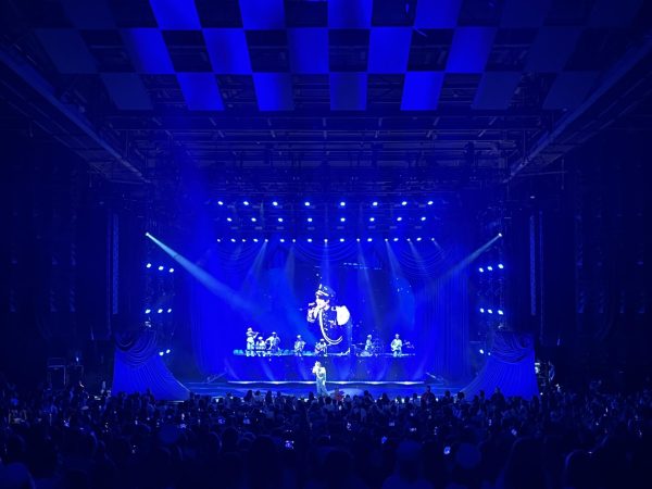 Conan Gray sings his final song, "Caramel," to the crowd during the encore of the show.