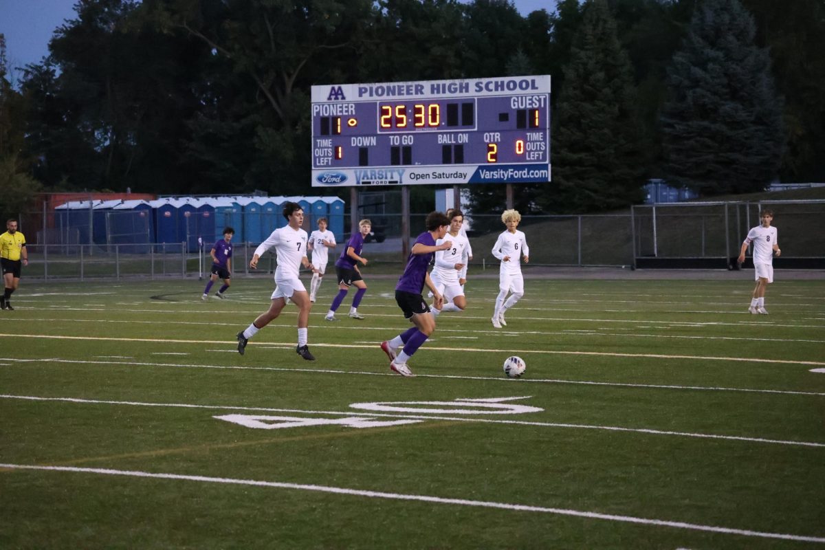 Pioneer's Joshua Silva prepares to pass the ball into space in the 55' minute of the game.