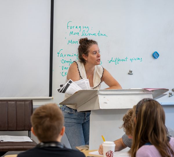 Sarah Roldán-Dodson stands as she teaches her second block Philosophy class.