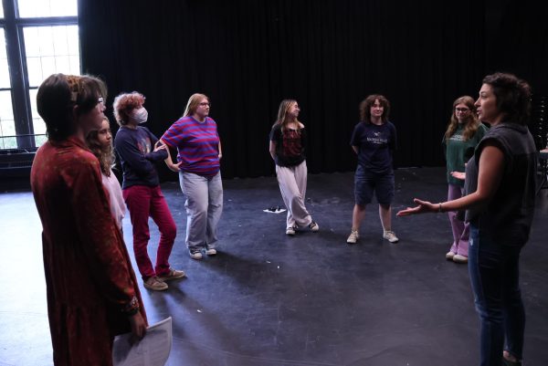 Emily Wilson-Tobin leads CET students in a theater warm-up prior to auditions. 
