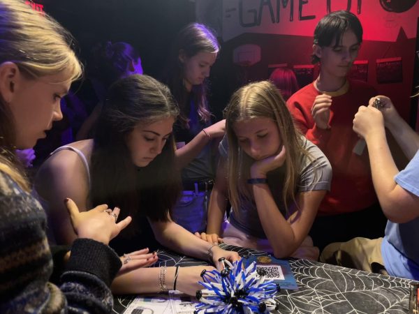 Kiley forumettes work together to solve a puzzle in the waiting room of Breakout Escape Rooms. The Kiley forum had gathered to do an escape room for Forum Day, a day dedicated for forums to spend time together and a longstanding tradition at CHS. "I feel more comfortable talking to people in the forum now." said freshman Kate Honka "We all know each other more, it was so much fun."