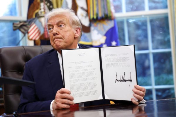 U.S. President Donald Trump shows a signed memorandum on the implementation of the death penalty in Washington D.C, at the White House in Washington, D.C., U.S., September 25, 2025. REUTERS