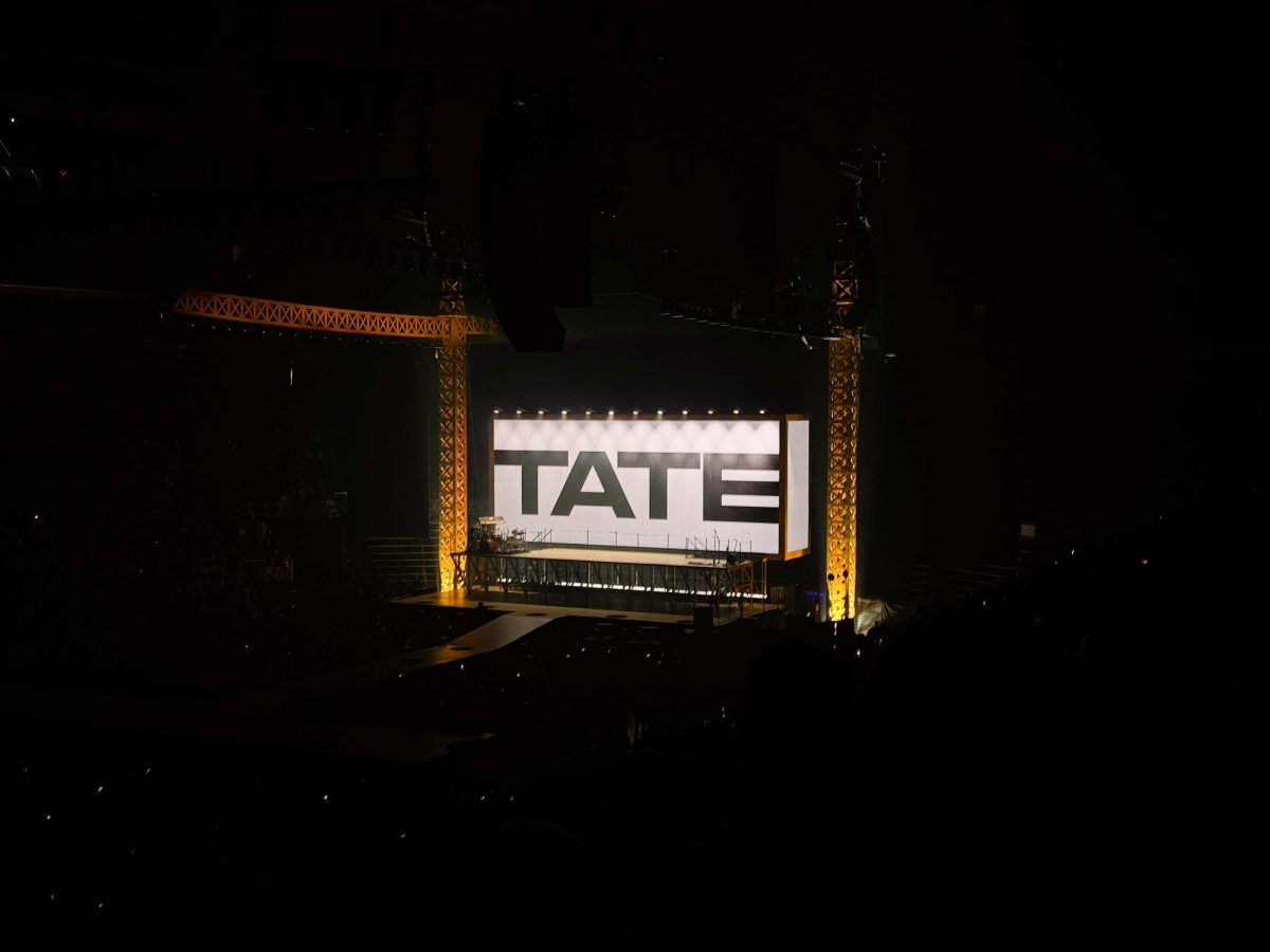 Tate McRae's stage setup glows as fans wait for the show to start.