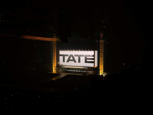Tate McRae's stage setup glows as fans wait for the show to start.