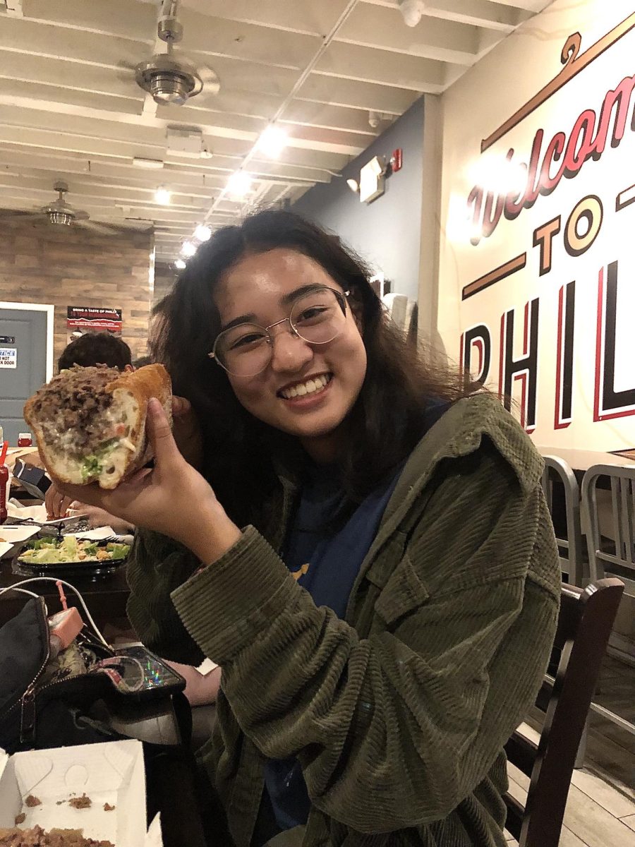 Kaylee Gadepalli holds up a cheesesteak too big for her mouth in the restaurant Cleavers. For the past few weeks Gadepalli has been prepping meticulously and coordinating everything for the mock trial trip to Philadelphia. "After all of the planning and prepping it felt surreal to be in Philadelphia," Gadepalli said. "I was relieved that the restaurants worked for everyone and that we all made our flights okay to Philadelphia."