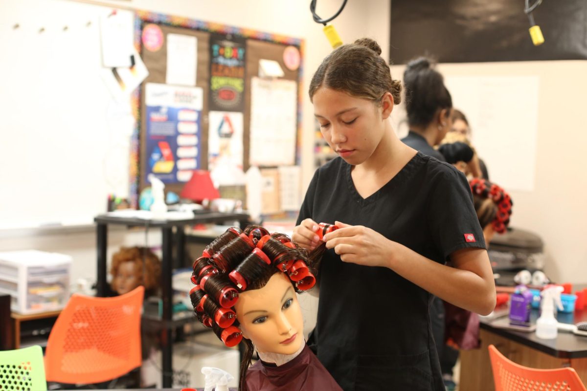 Azalia Harmon is at the Huron Valley Beauty Academy in Saline, working on a roller set on a mannequin. She recently started her program at the HVBA and she's been learning so many new skills these past few weeks. "The roller sets are really hard," Harmon said. "But I think after some practice I can make them perfect."