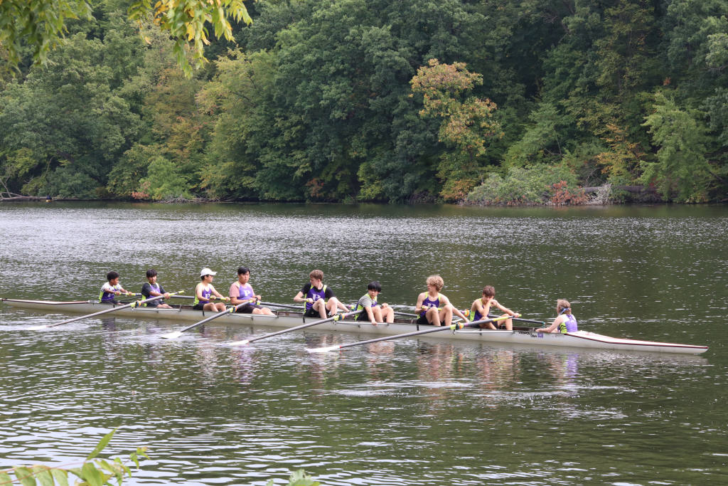 Members of Pioneer crew compete on the Huron River. Before racing, junior Micheal Davis likes to have a good mindset. "Talking to my friends gets me really in the mood" Davis said "I'll listen to calm music"