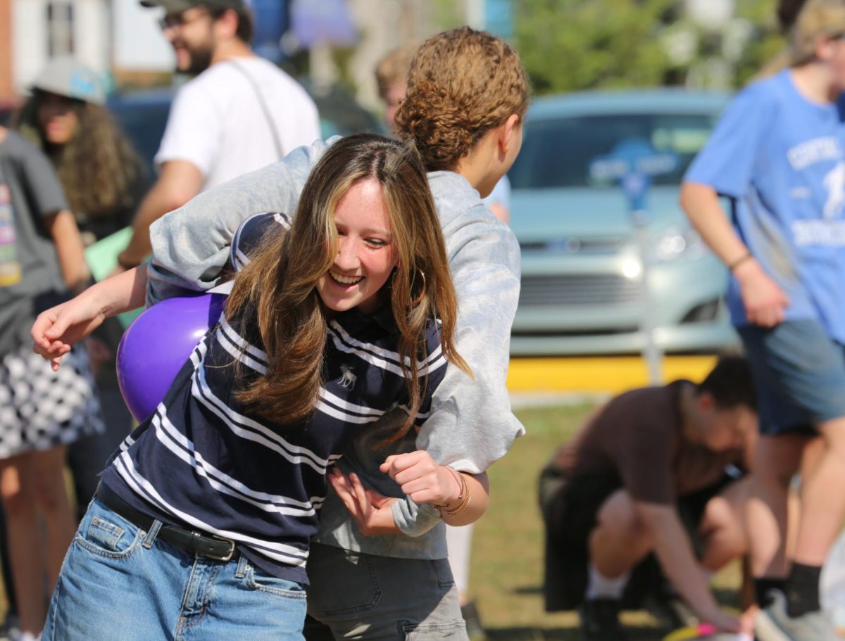 Veronica Herrold competes in the balloon event on Fall Field Day. Herrold and her friend Annette Dobson had the time of their lives as they tried to not let the balloon slip during a true forum bonding moment. 
"It was just really fun to bond with everyone and actually see them participate," Herrold said. "I'm pretty sure our fourm got second to last place, but at least we didn't lose!"