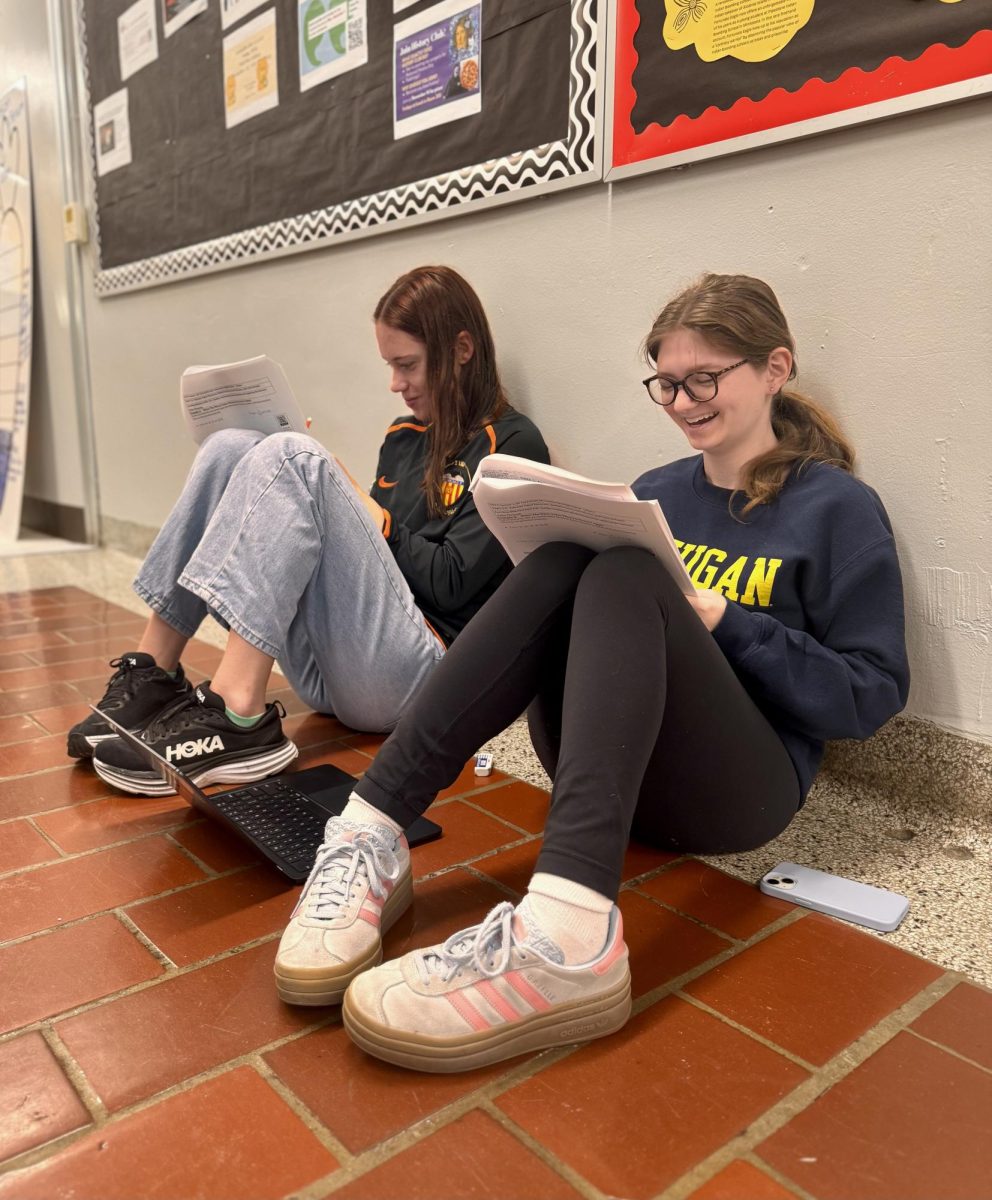 Mia Rubenstein and Ava Griffith share a laugh in the second-floor hallway as they work on calculus homework. Both have been feeling more confident in the class since the start of the year, and it's even becoming enjoyable. "I'm starting to really like calculus," Rubenstein said. "Now that I understand it more, it feels less like a chore and more like a choice."