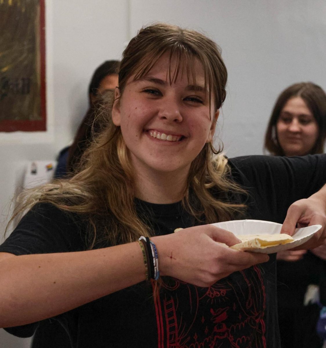 Rosie Matish smiles with her quesadilla from Friday's quesadilla sale. The Mosher Forum raised over $100 for Food Gatherers. "I love buying from sales during the [Food Gatherer's] fundraiser," Matish said. "It feels nice to get lunch and support a good cause at the same time."