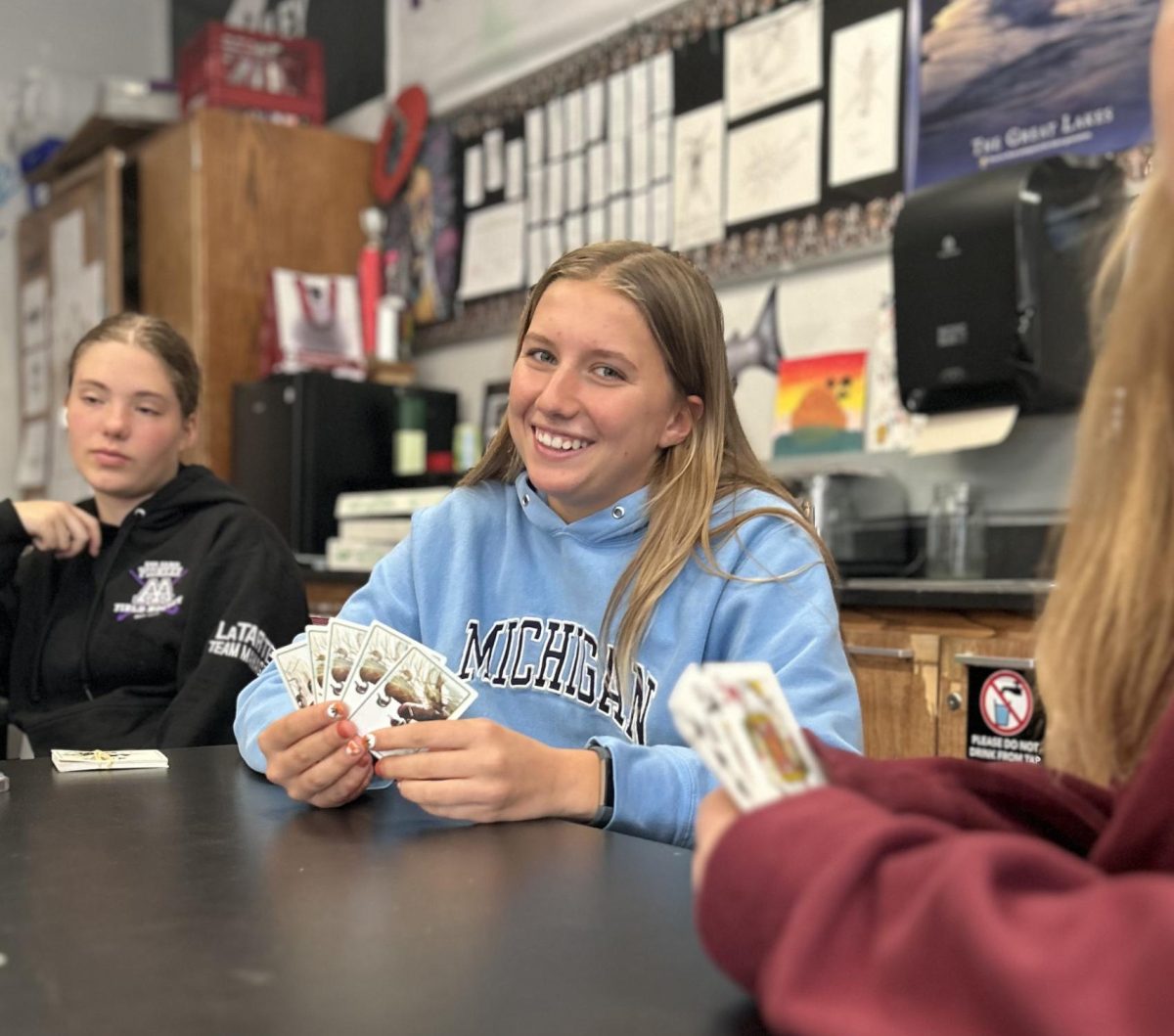 During lunch, Anna Chomistek plays Euchre inside Courtney Kileys classroom. She felt very competitive, but enjoyed the game no matter the outcome. "It's a really fun club," Chomistek said. "Its nice to be able to play Euchre with people I don't mind being around."