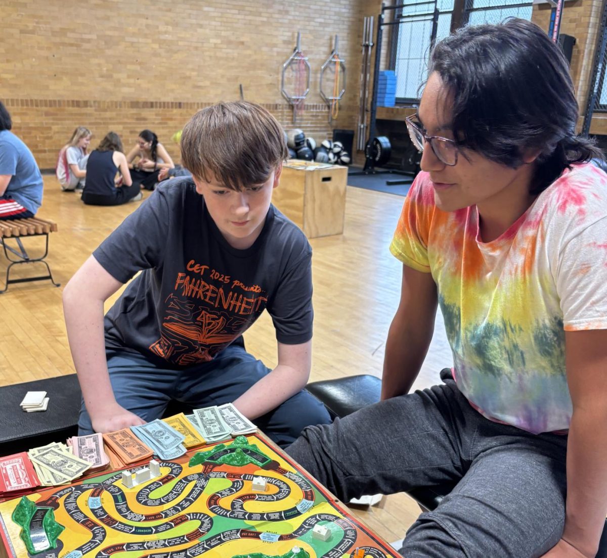 Max Bravo-Gomez and Lucas Love-Ramirez play the game of life in their gym class. Thay had a free day so the class decided to have a board game marathon. "We get to play games today instead of working out," Bravo-Gomez said. "It's a lot of fun and a cool thing to do before our next class."