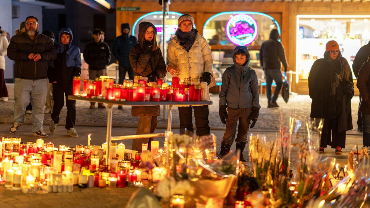 People mourning the lives lost from the Swiss Ski Resort Fire.

REUTERS/Umit Bektas (https://www.reuters.com/authors/umit-bektas/)