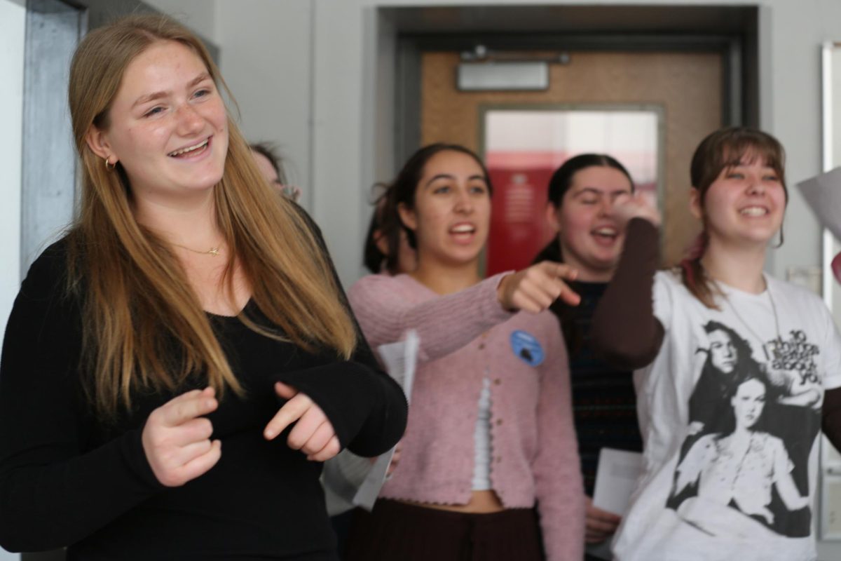 Lucy Lowenschuss, Ellora Kirbat, Mira Authier, Avery Nelson and Rosie Matish perform a singing valentine during block 4.