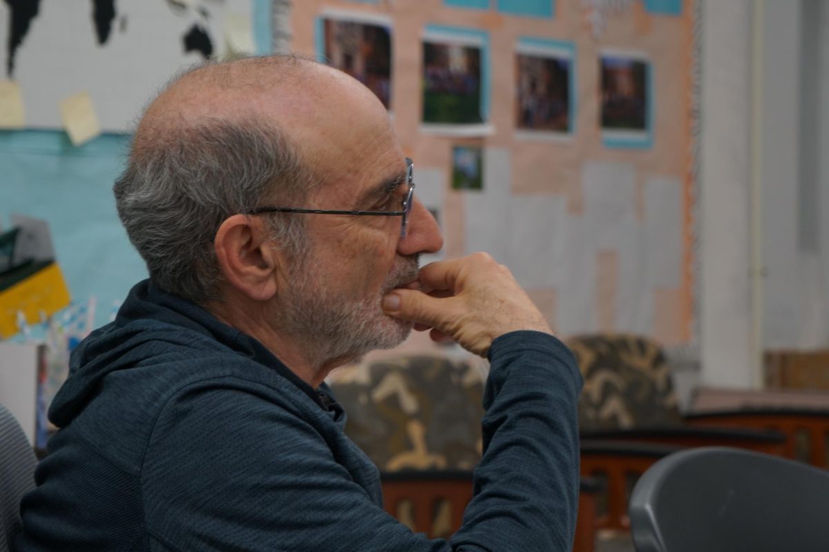 Judah Garber pauses during a mock trial practice.  He offers advice and insight after years of law and advocacy work. He has coached the CHS Mock Trial team through over a decade of wins on the regional, state and even international scale.