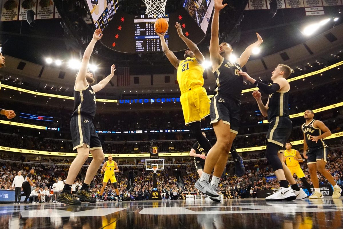 Mar 15, 2026; Chicago, IL, USA; Michigan Wolverines forward Morez Johnson Jr. (21) drives to the basket during the second half against the Purdue Boilermakers during the men's Big Ten Conference Tournament Championship during the first half at United Center. Mandatory Credit: David Banks-Imagn Images